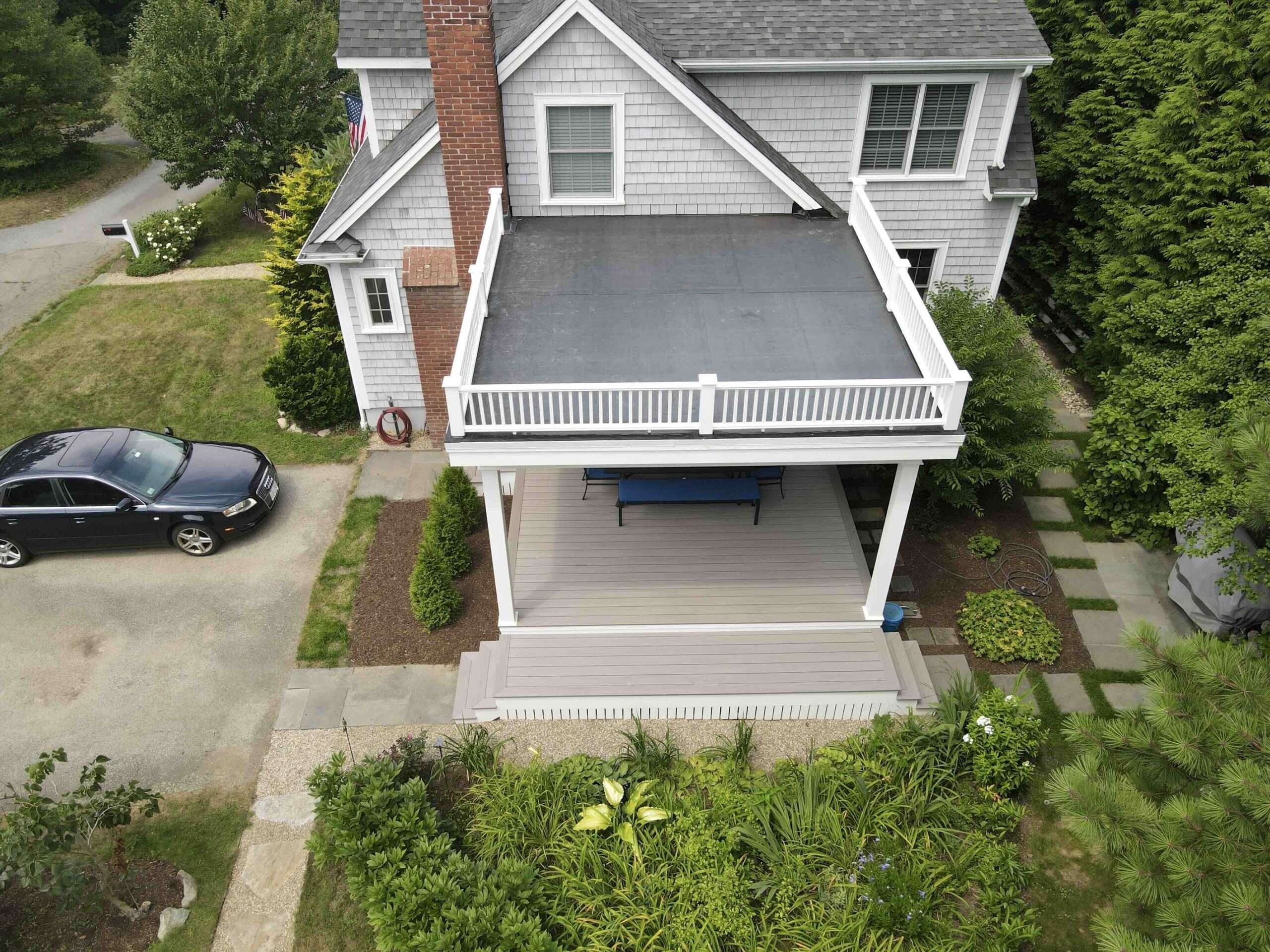aerial-view-of-the-commercial-under-deck-with-white-aluminum-railing-and-outdoor-living-spaces-in-worcester-ma.jpeg