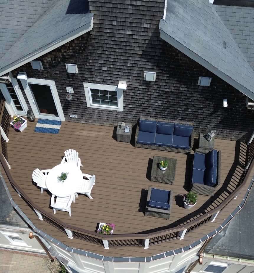 Aerial view of the composite deck installation with outdoor living furniture in worcester ma