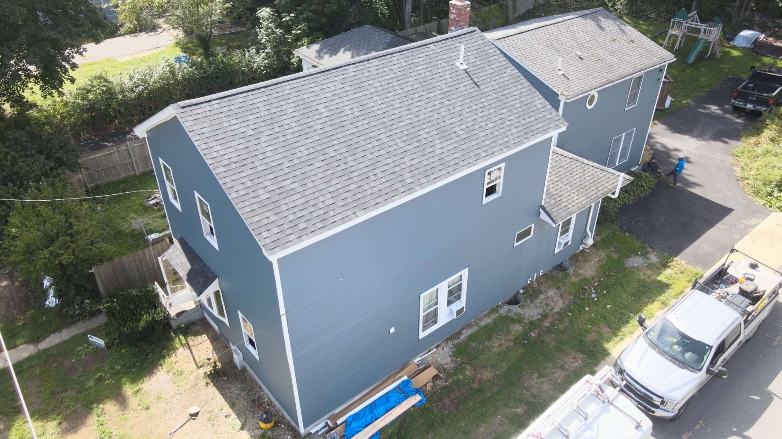 Aerial view of the house with siding installation and roof raised in worcester ma