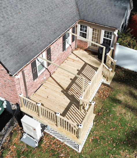 Aerial view of the pressure treated deck with skirting and railing on worcester ma