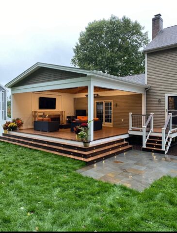 Covered deck with lights on stairs steps with outdoor living spaces in worcester ma