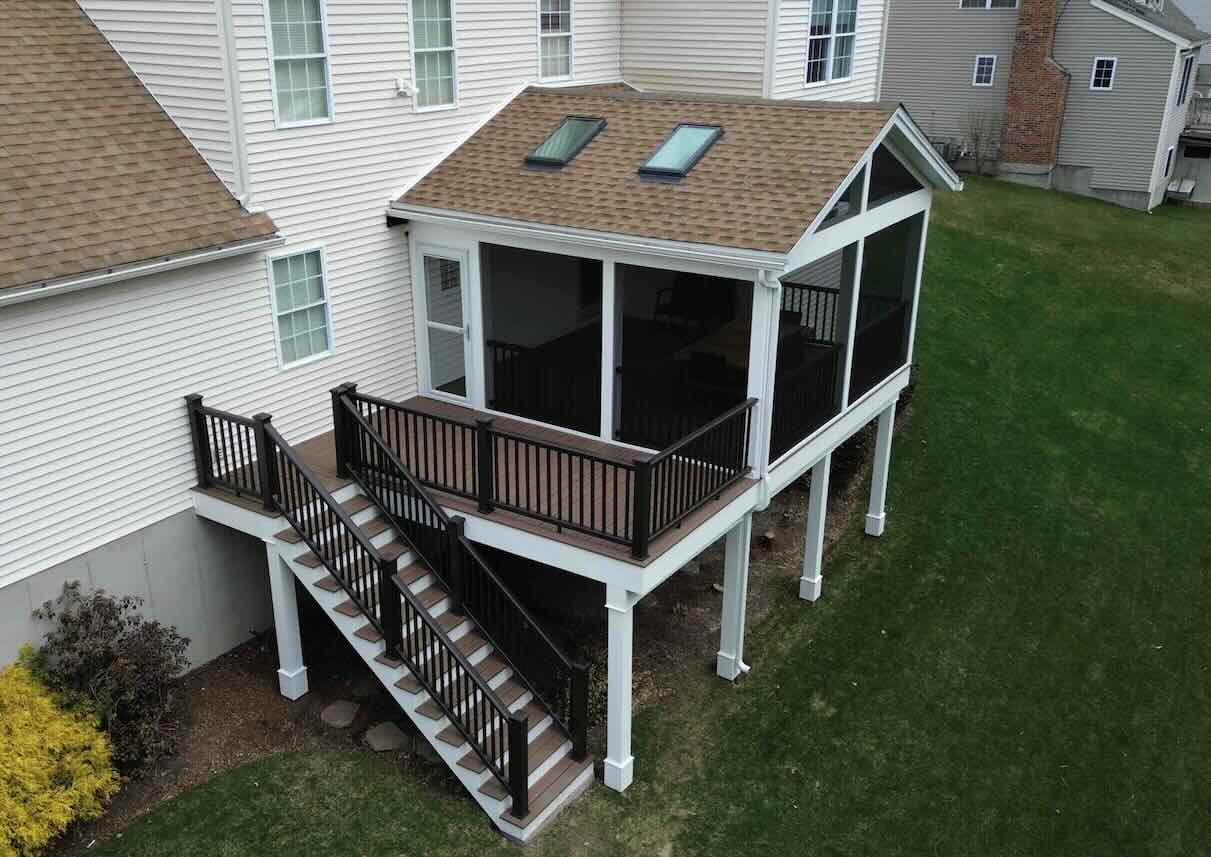 elevated-commercial-deck-with-black-aluminum-railing-and-a-screened-in-porch-in-worcester-ma.jpg