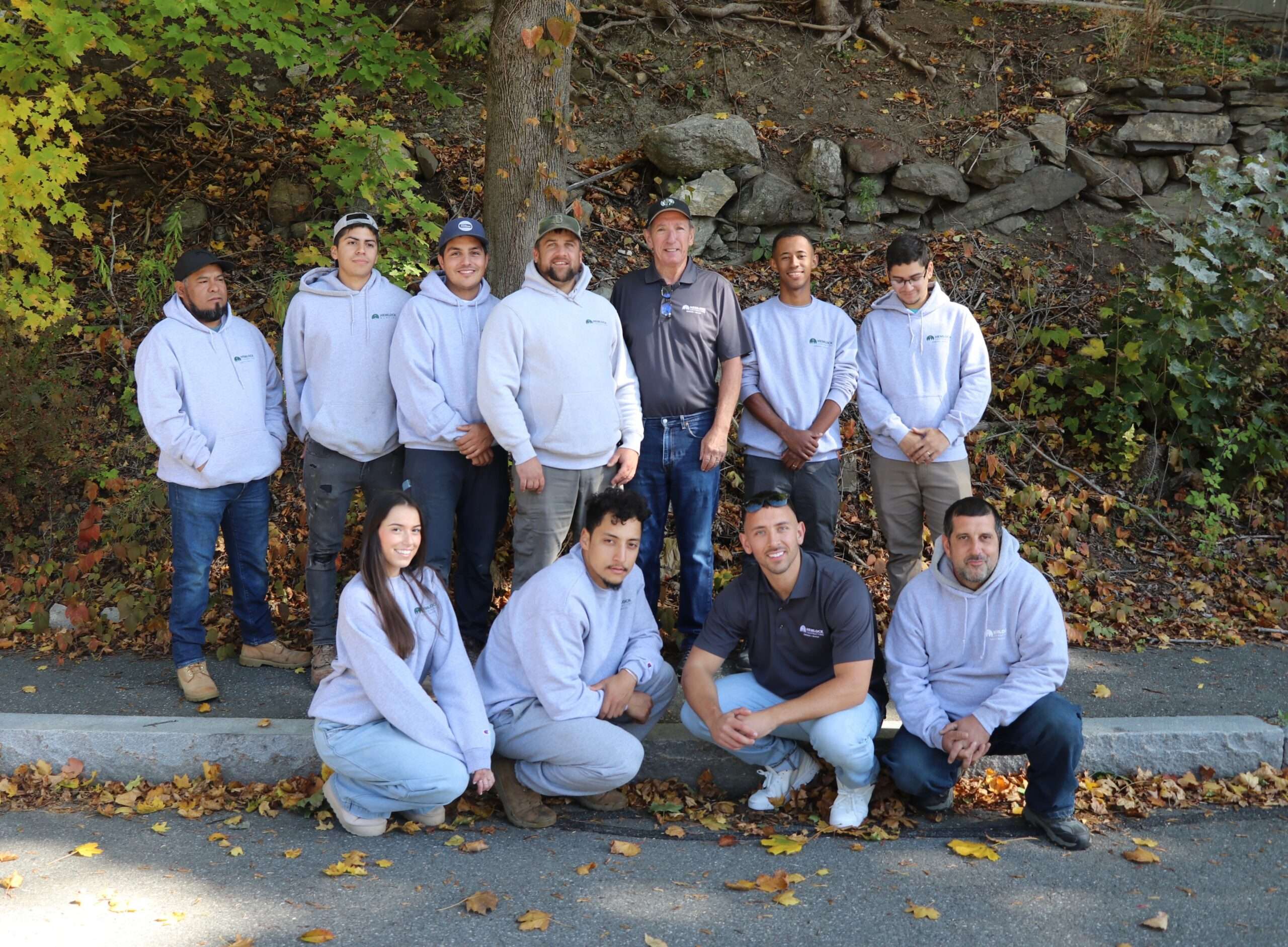Hemlock contracting team expert posing with their owner in worcester ma