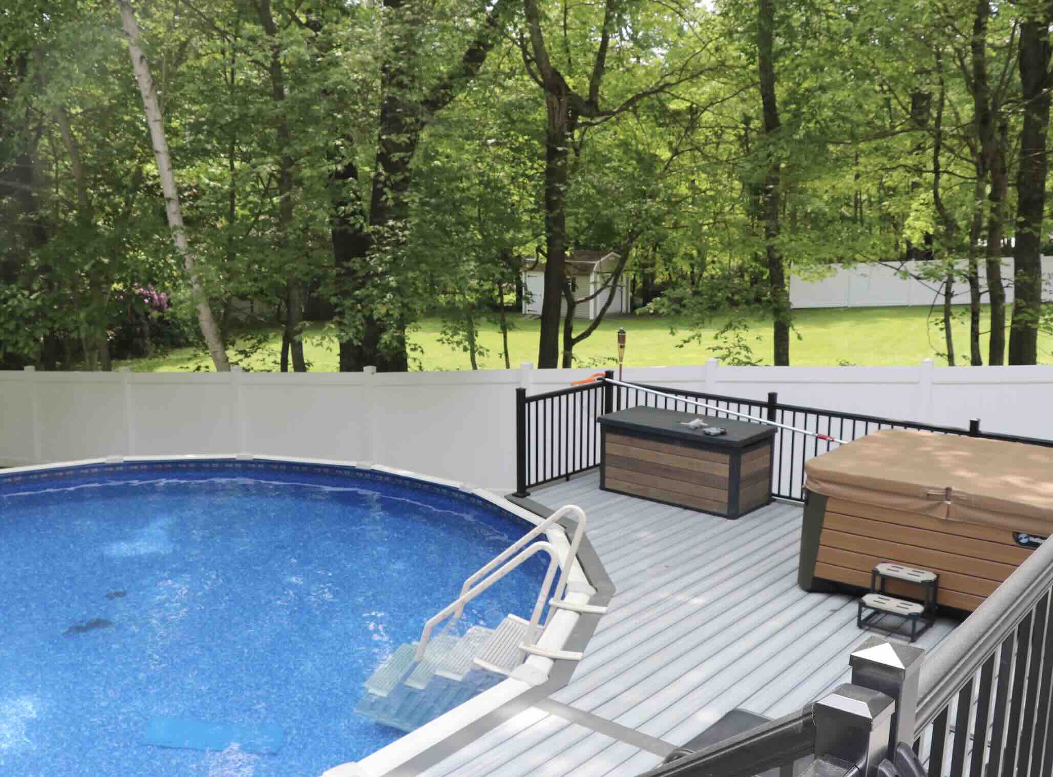 modern-pvc-deck-with-black-aluminum-railing-and-wooden-box-in-worcester-ma.jpg