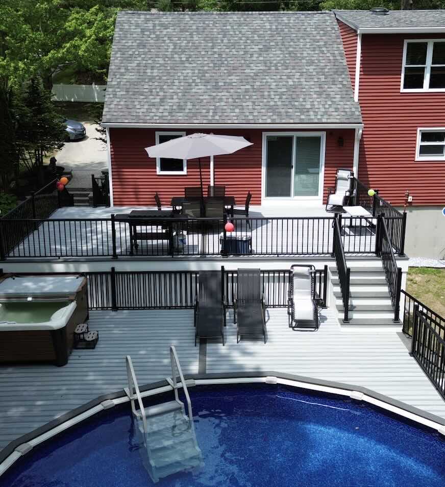 pvc-pool-deck-with-black-metal-railing-and-outdoor-living-spaces-in-worcester-ma.jpg
