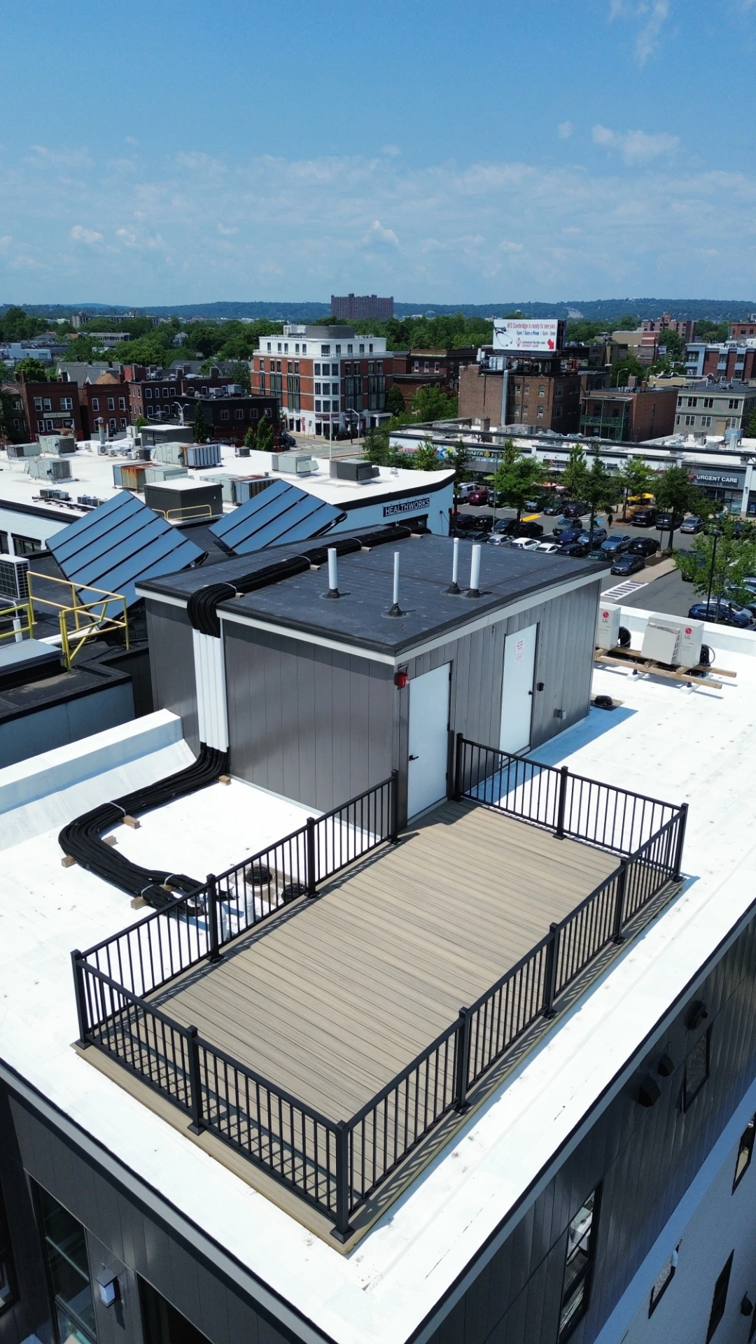 Residential deck on the private rooftop terrace overlooking urban neighborhood in worcester ma